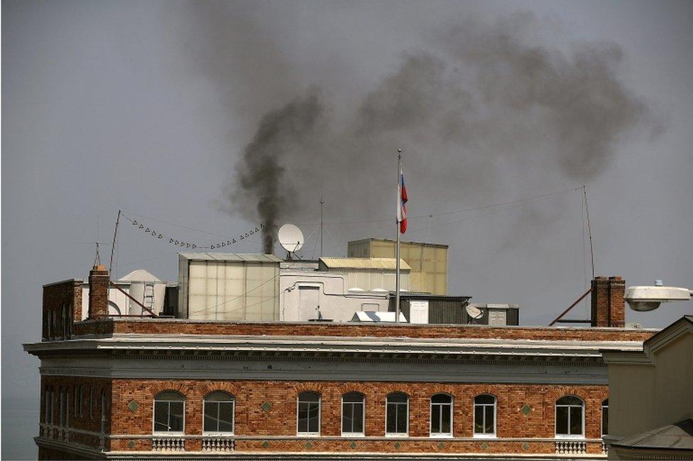 Black smoke billows from a chimney on top of the Russian consulate on 1 September 2017 in San Francisco, California