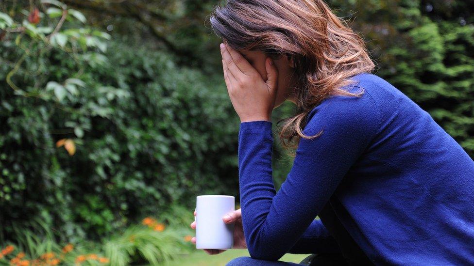 A woman showing signs of depression