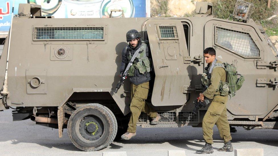 Israeli soldiers search for the killers of an Israeli settler near Nablus in the occupied West Bank on 10 January 2018