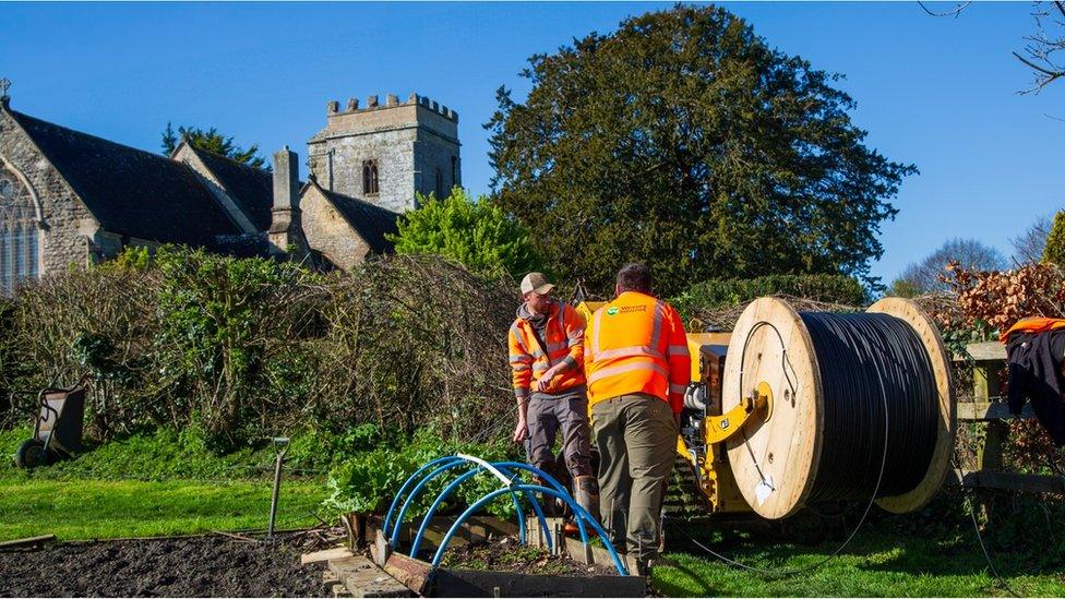 Contractors putting in broadband cables