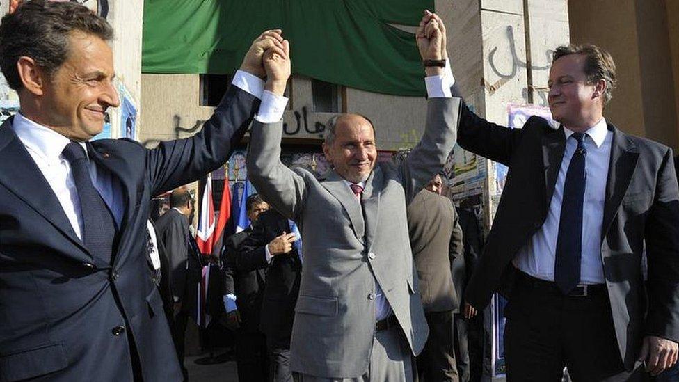 Nicolas Sarkozy and David Cameron with National Transitional Council head Mustafa Abdul Jalil in Libya in 2011