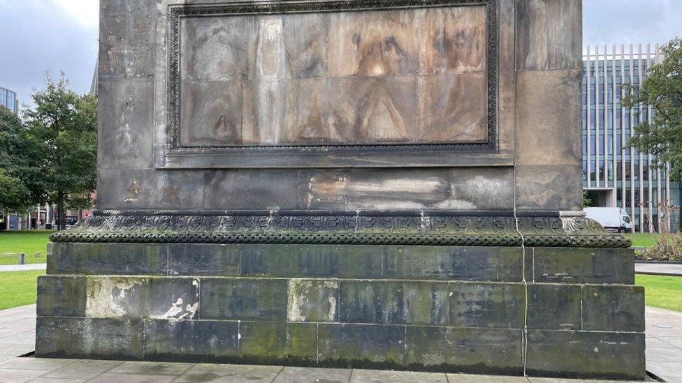 Where the missing plaque is supposed to go on the monument