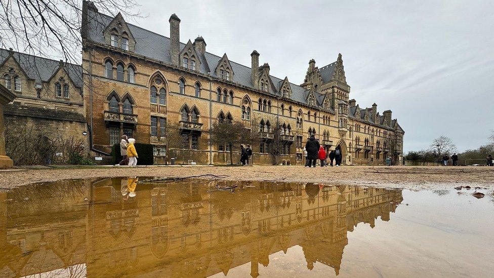 Building reflected in a puddle in Oxford