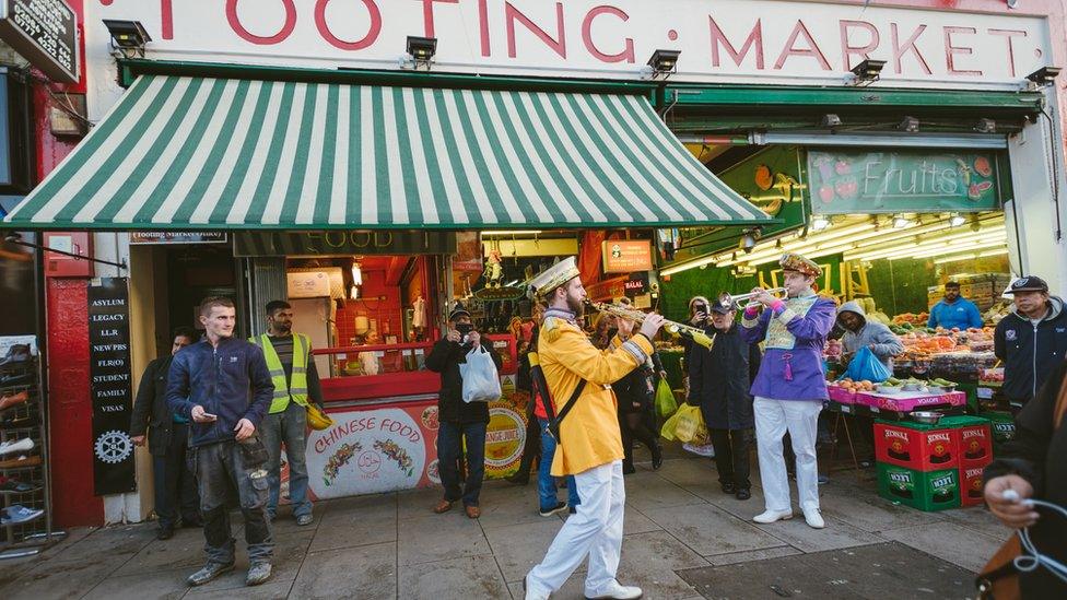 Musicians play outside Tooting Market