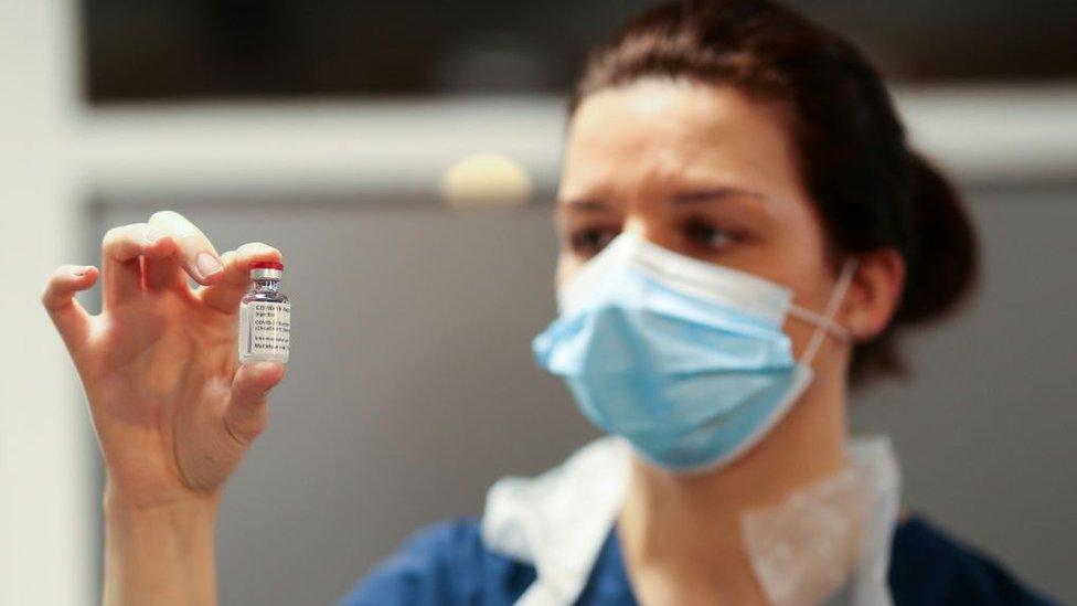 nurse with vaccine