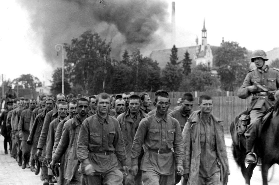 Germans with Soviet POWs, Riga, July 1941