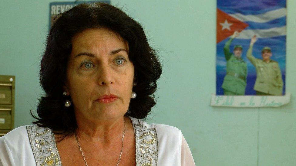 Zoe de la Red Iturria pictured in front of a Cuban flag