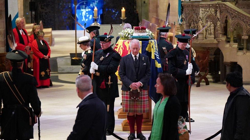 Members of the public file past while the King and his three siblings post a vigil around the coffin