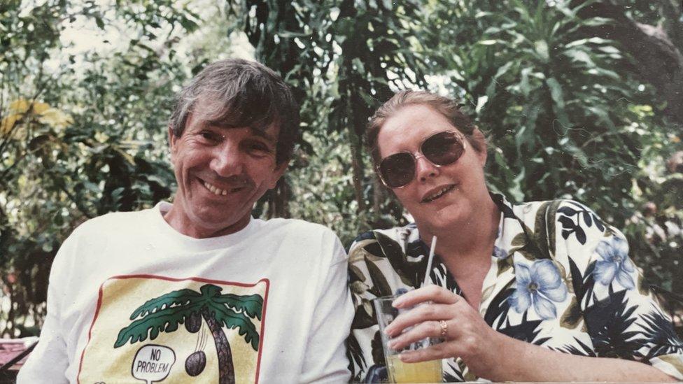 John and Helen Heath smiling, looking like they are on holiday