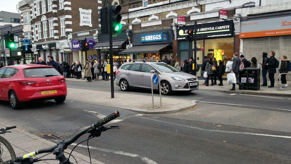 Big queue going down a street