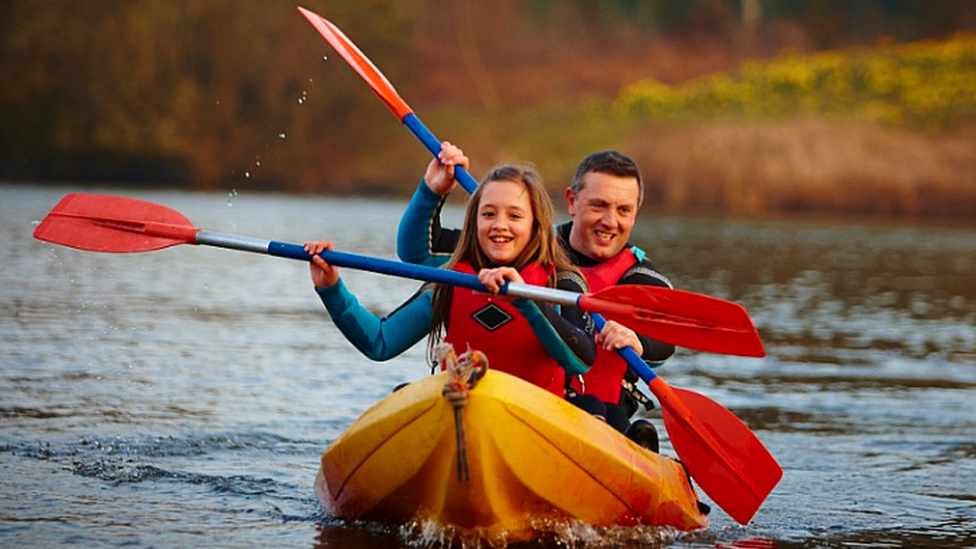 Man and child kayaking