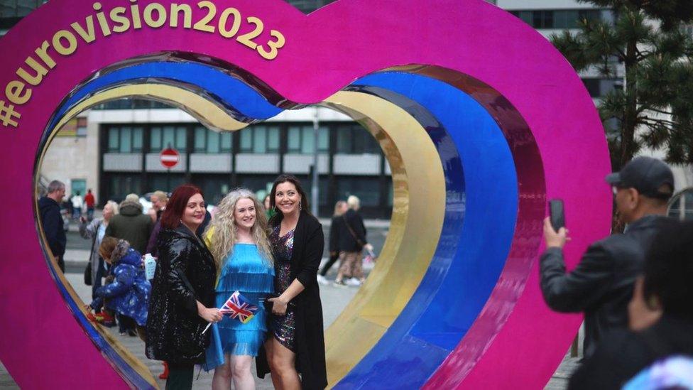 Women pose at Eurovision heart