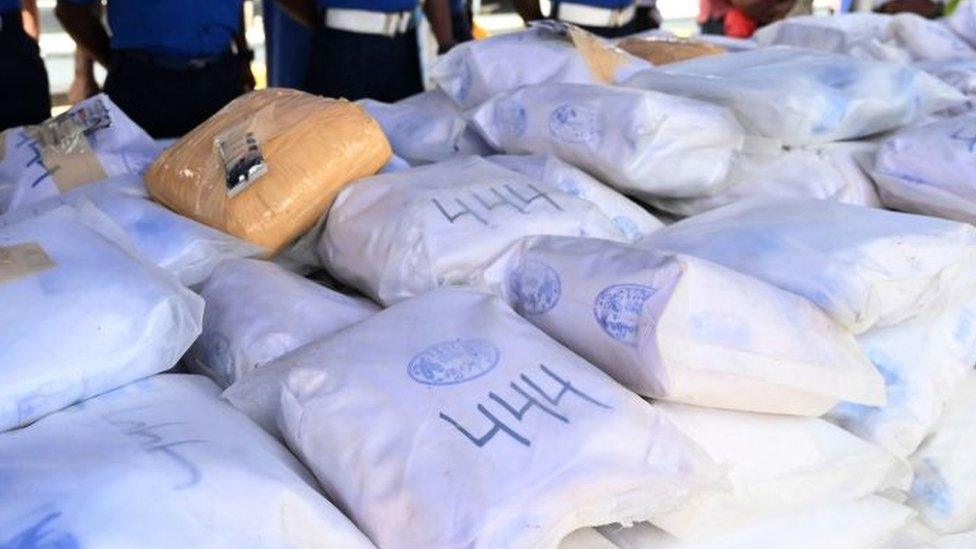 Sri Lanka Navy personnel shows a haul of heroin seized from a fishing vessel off the islands southern waters in Colombo on 25 January 2022