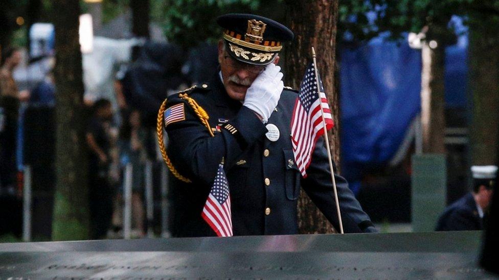 A guest wipes a tear at the New York memorial