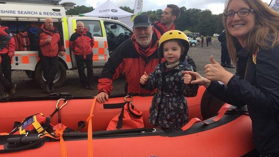 girl in search and rescue boat