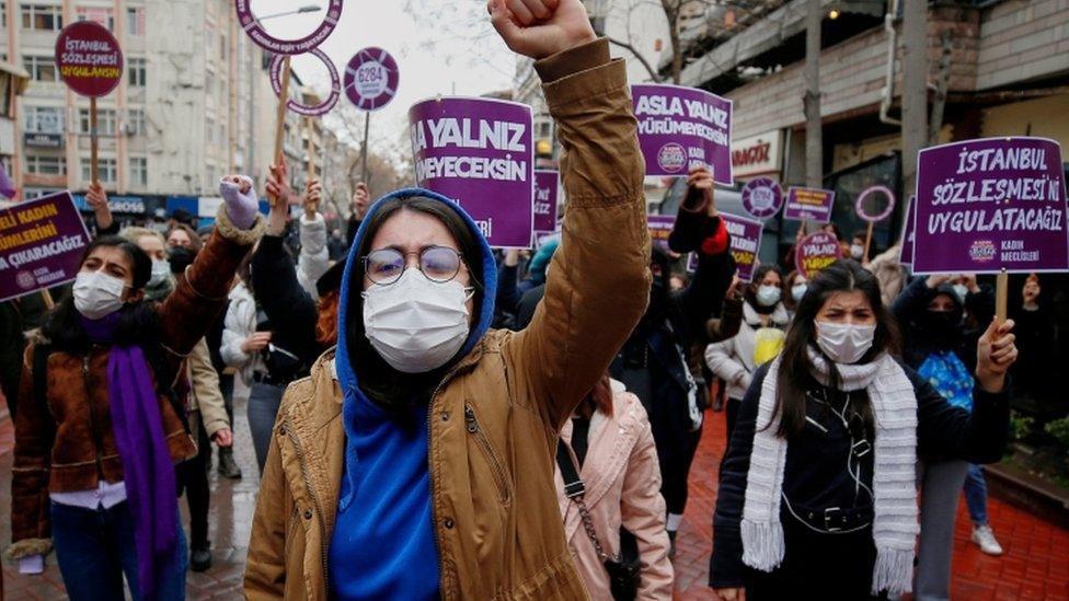 People participate in a protest against Turkey's withdrawal from Istanbul Convention