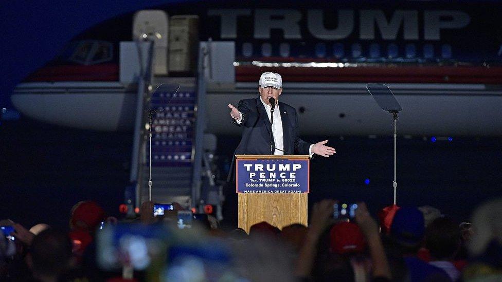 Donald Trump speaks in front of his jet in Colorado.