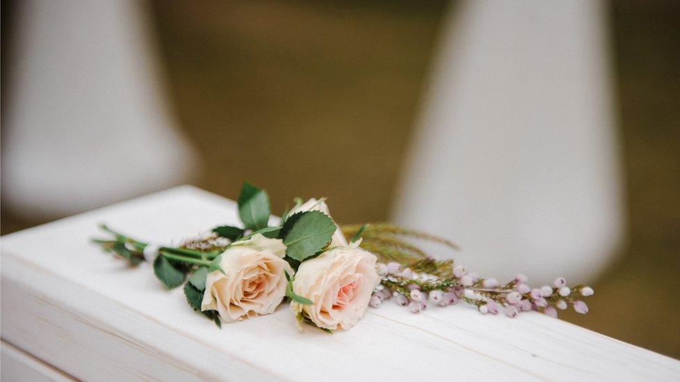 roses on a coffin