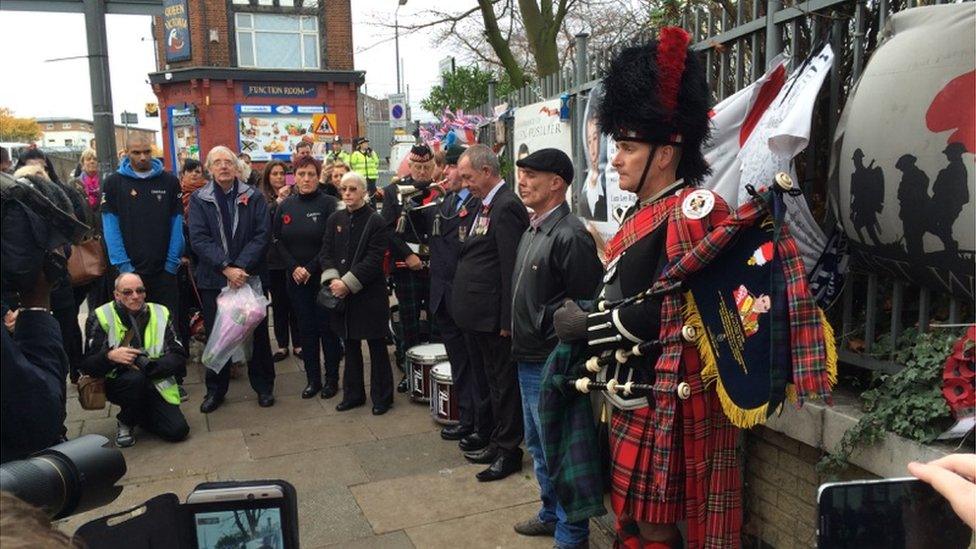 People gather at the site where Lee Rigby was killed