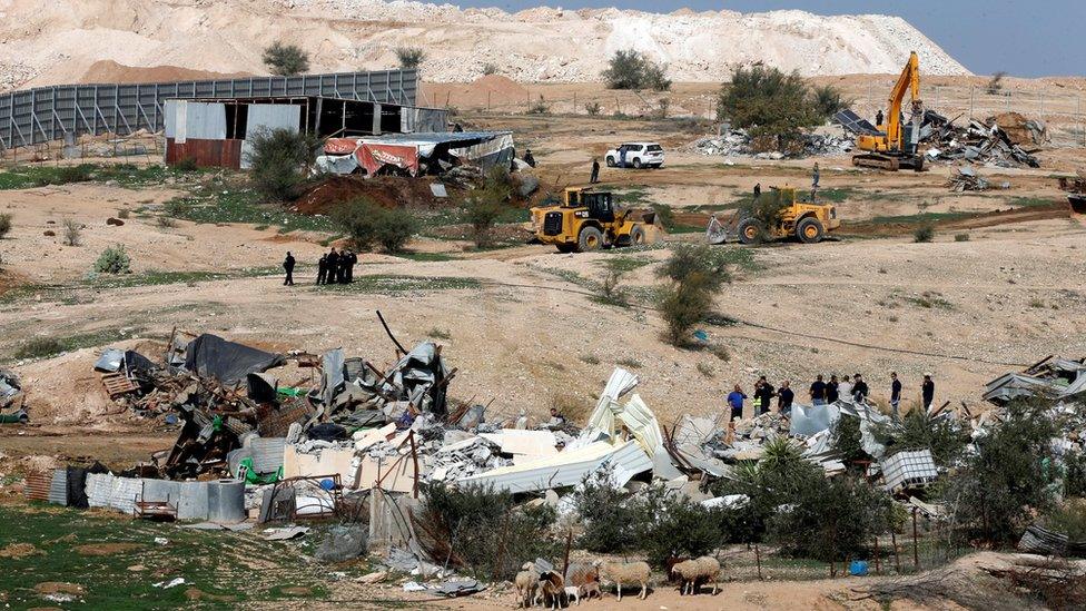 Bulldozers demolish Bedouin dwellings deemed by a court as having been built illegally on state-owned land in Umm al-Hiran (18 January 2017)