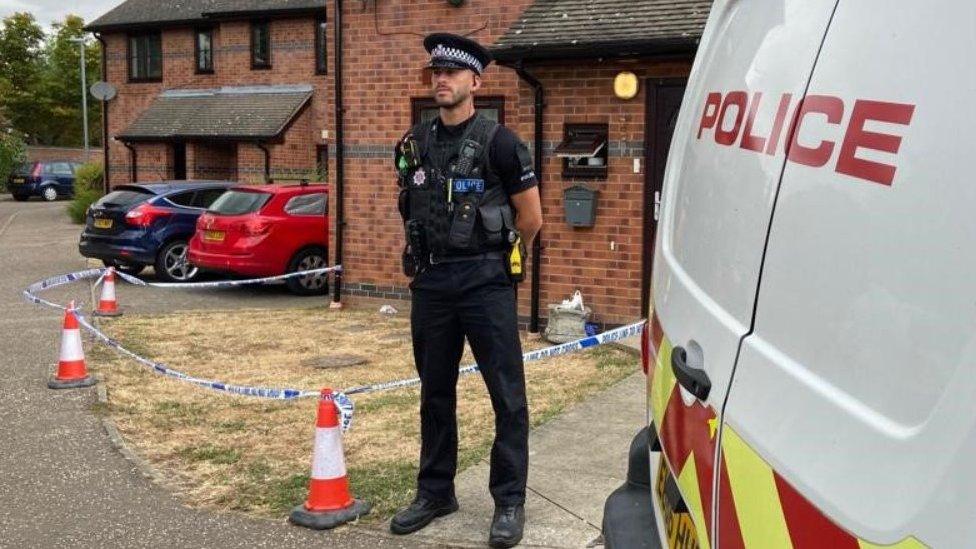 Police officer outside house in Nelson Grove in Chelmsford