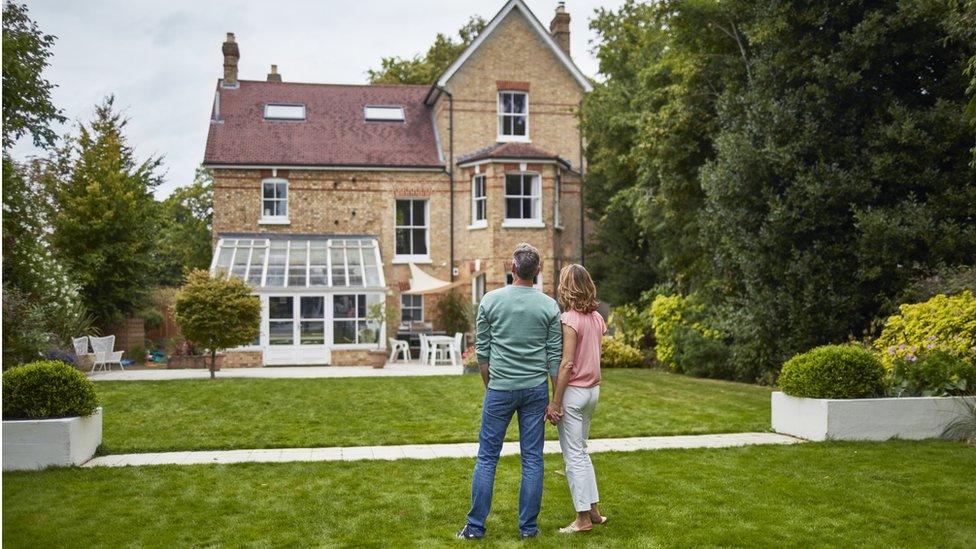 couple outside house