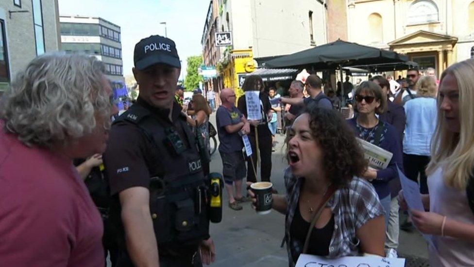 Angry exchanges outside library