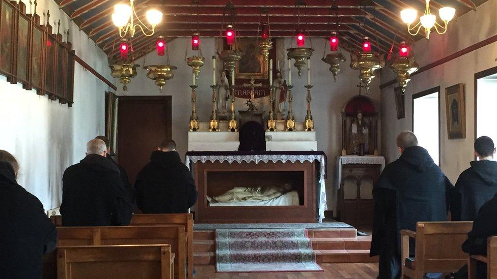 Monks praying in the chapel