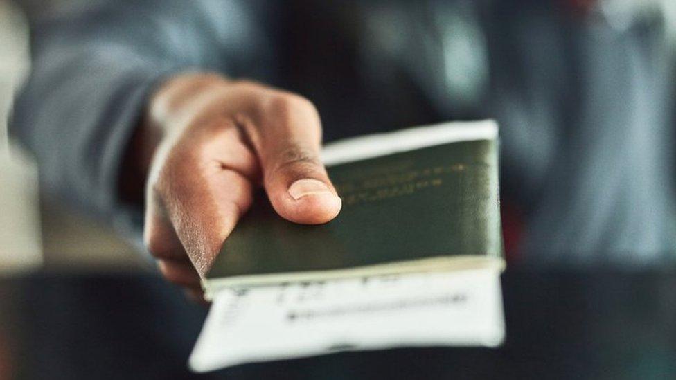 Person holding a passport