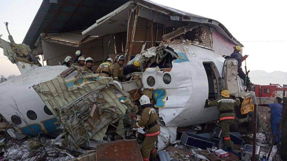 Emergency personnel at the site of a plane crash near Almaty, Kazakhstan, 27 December