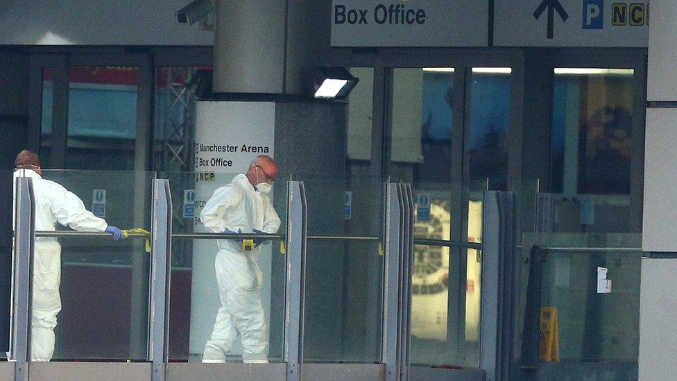 Forensic investigators examined the venue in the aftermath of the bomb