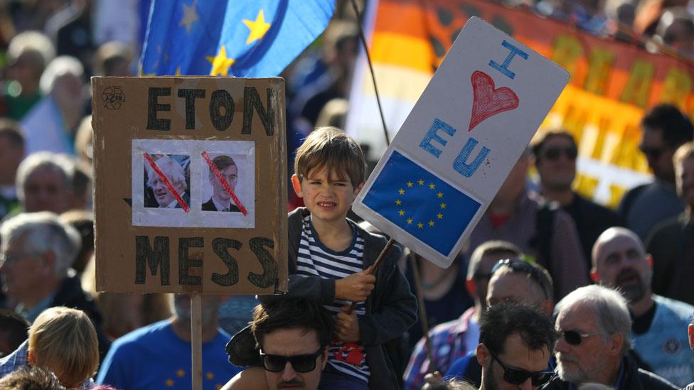 A young boy in the crowd