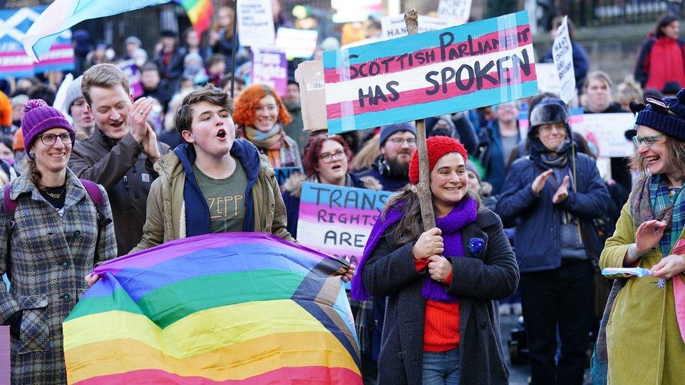 People demonstrate in favour of trans rights outside the UK government office in Edinburgh