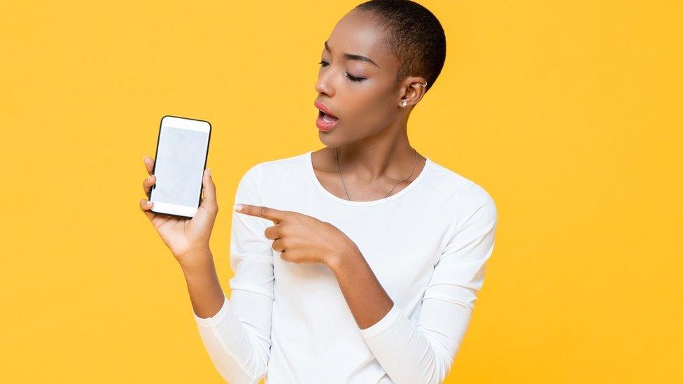 Black woman with a phone