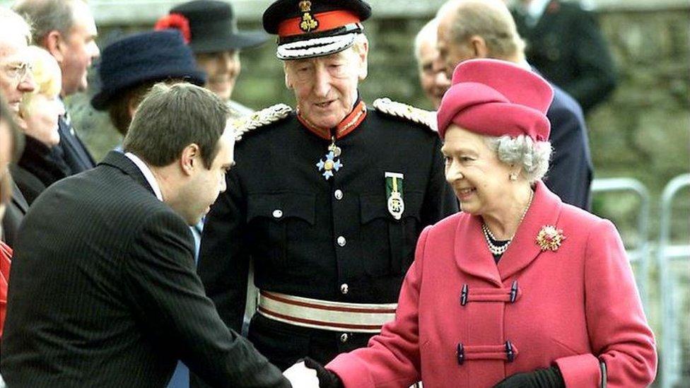 Queen Elizabeth II arrives in Londonderry, Northern Ireland for the first time in half a century, Thursday 15 November, 2001, and is greeted at the Maydown Ebrington Centre by the Social Development Minister, Nigel Dodds.