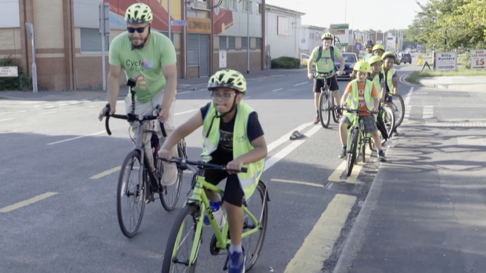 Ibe Hayter with young cyclists