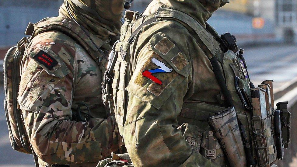 Russian servicemen stand guard near the Kakhovka Hydroelectric Power Plant near Kherson, southern Ukraine. Photo: May 2022