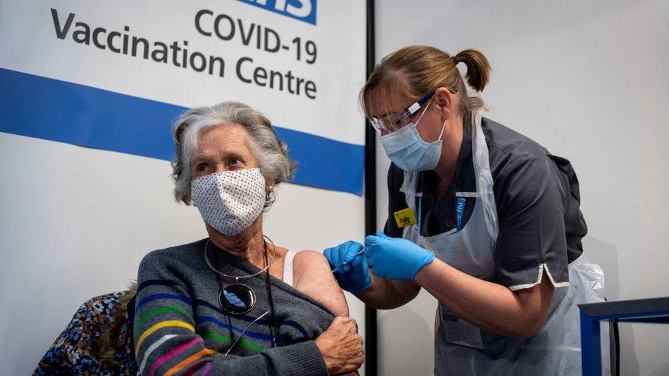 old-lady-getting-vaccine-from-nurse.