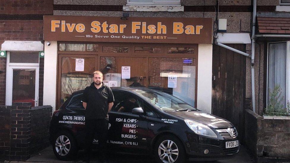 Stuart Cooper outside his shop