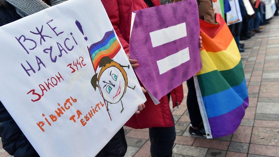 Activists and members of the LGBT community demonstrate outside the Ukrainian parliament in Kiev