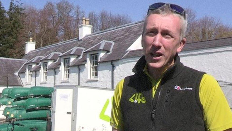 Martin McMullen from Life Adventure Centre standing next to some of his equipment