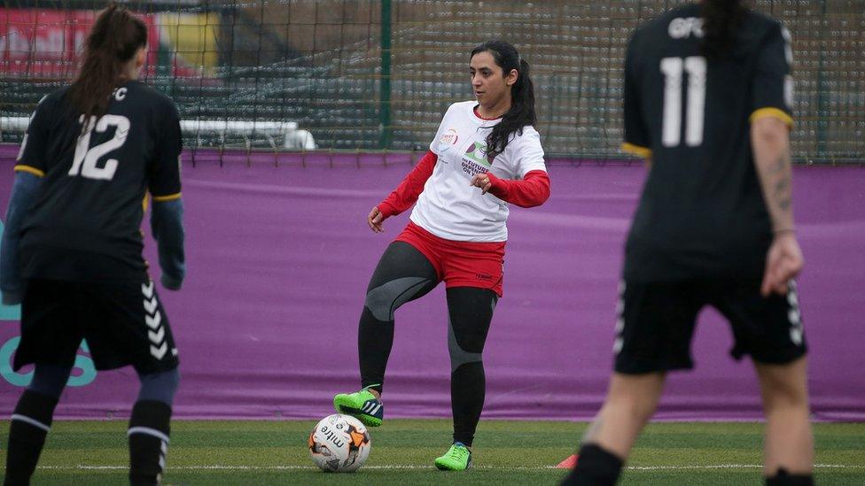 Former Afghanistan women's football captain Khalida Popal (C) attends a training session in south London on March 30, 2018.