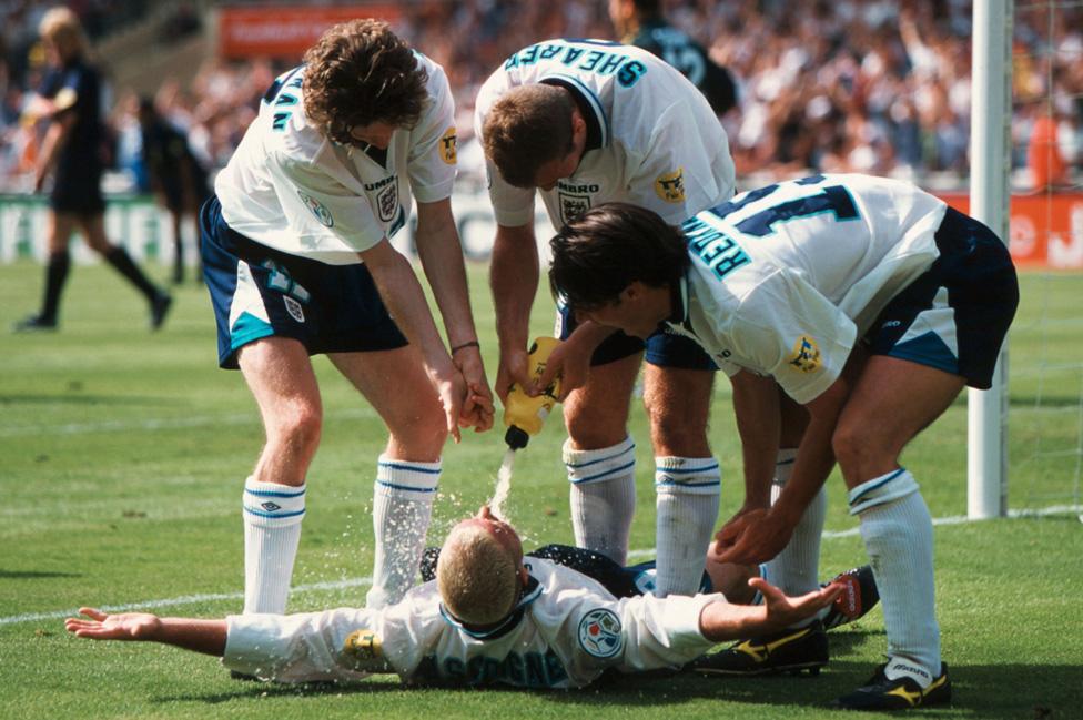 Paul Gascoigne, lying down, celebrates scoring against Scotland at Wembley during Euro 96