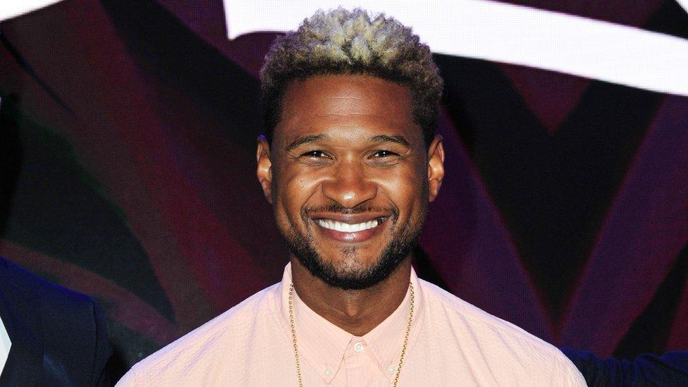 This is a photo of R&B singer Usher smiling.