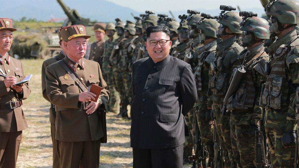 This undated photo released by North Korea's official Korean Central News Agency (KCNA) on 26 August 2017 shows North Korean leader Kim Jong-un (C) presiding over a target strike exercise conducted by the special operation forces of the Korean People's Army (KPA) at an undisclosed location