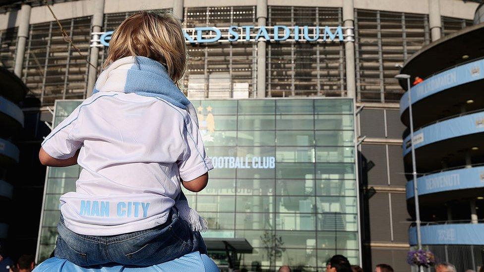 A-girl-outside-Manchester-City-stadium