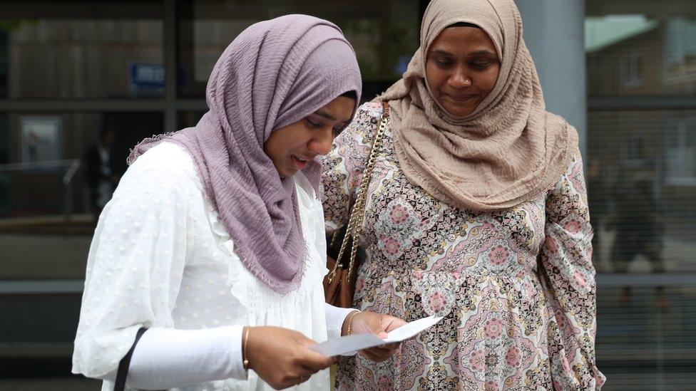 A student receives their results at Peter Symonds College in Winchester