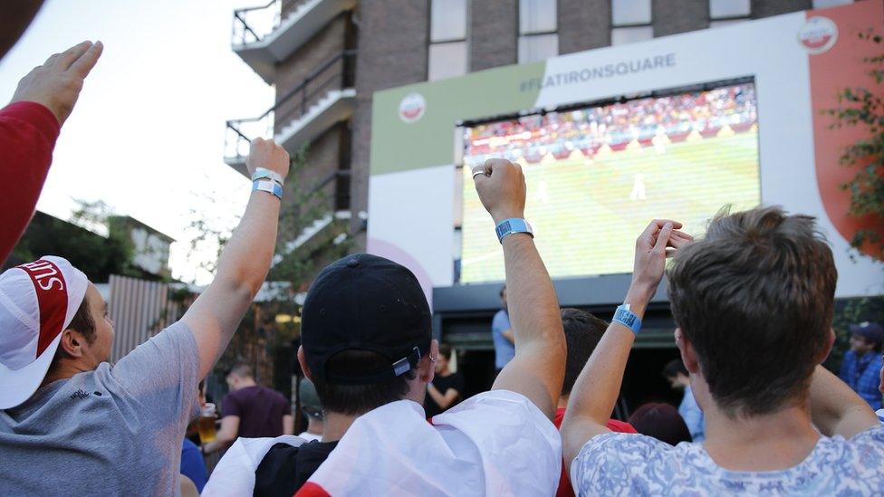 fans in London watch game