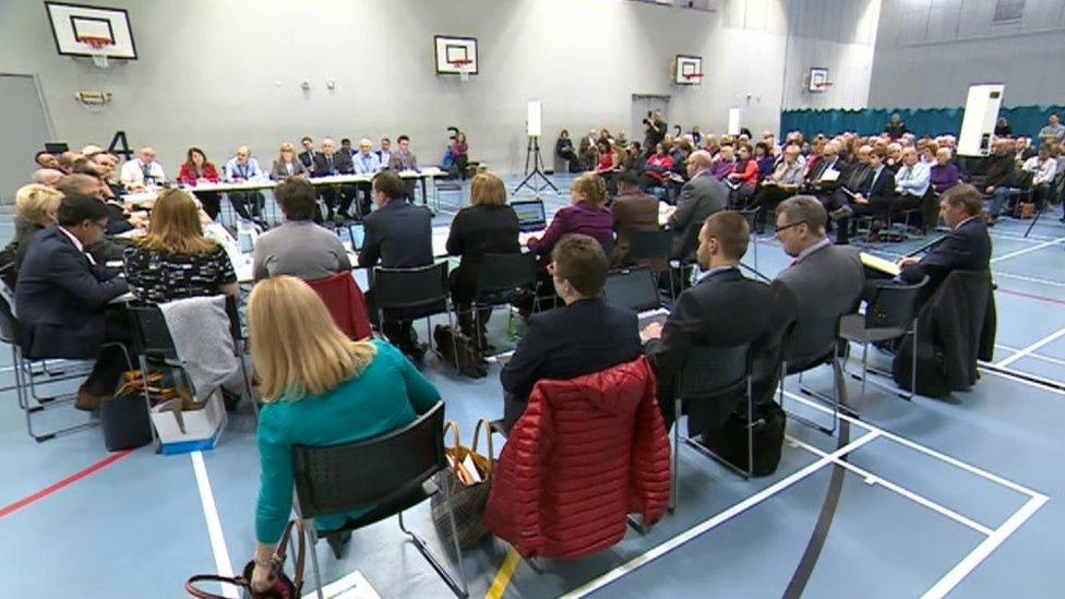 Health chiefs announce their decision at the public meeting