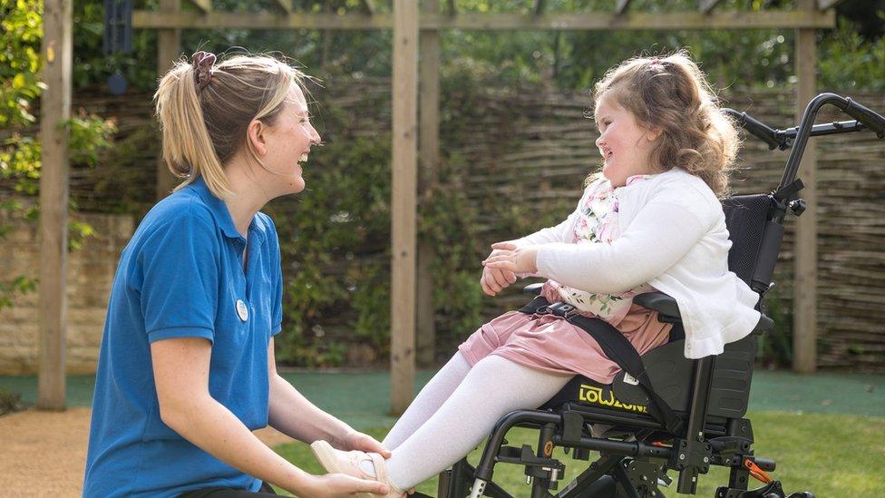 Ellie with Julia's House nurse Molly Douglas in the Wiltshire hospice garden